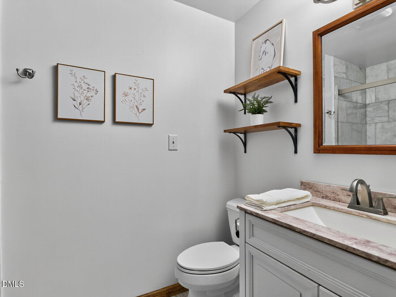 509 Holtz Lane Cary, NC 27511 - Photo 28 of 42 a bathroom with a granite countertop toilet sink and mirror
