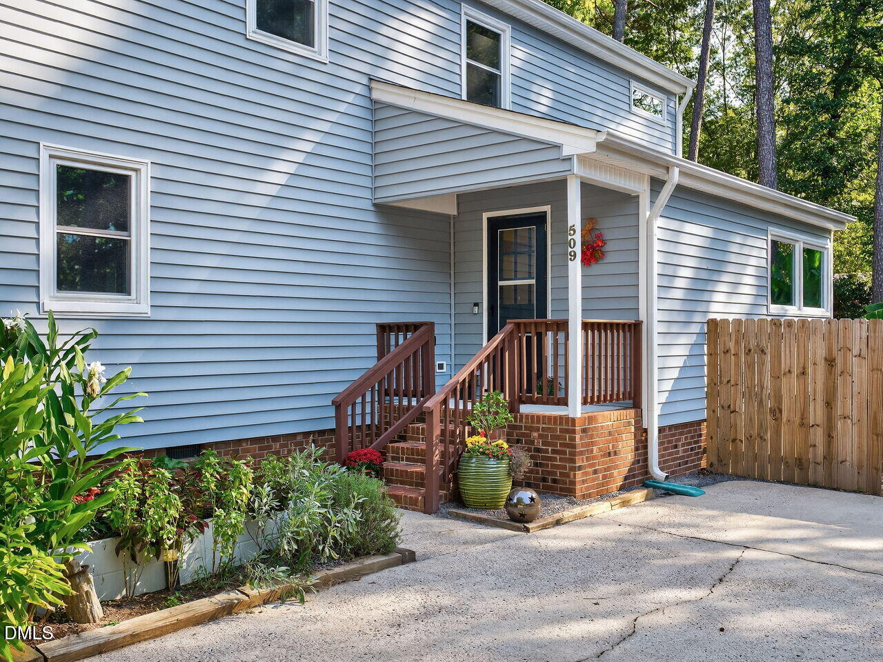 509 Holtz Lane Cary, NC 27511 - Photo 3 of 42 a view of a house with brick walls