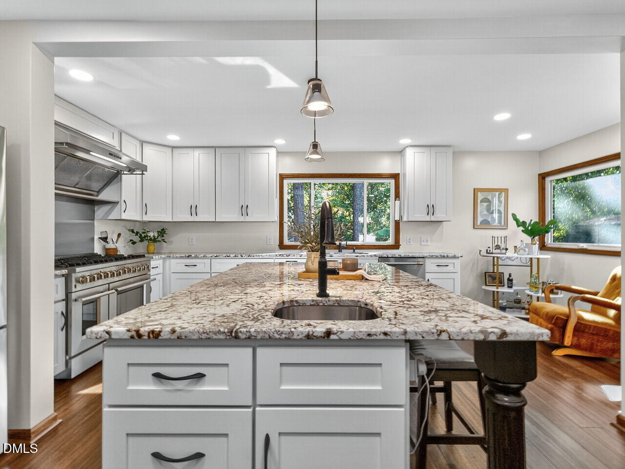 509 Holtz Lane Cary, NC 27511 - Photo 6 of 42 a kitchen with a stove a sink a refrigerator and wooden cabinets