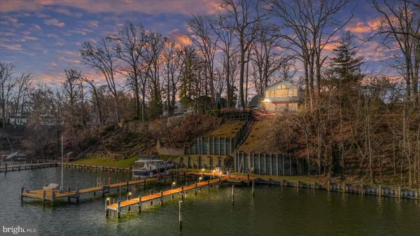 a view of a lake with boats and trees