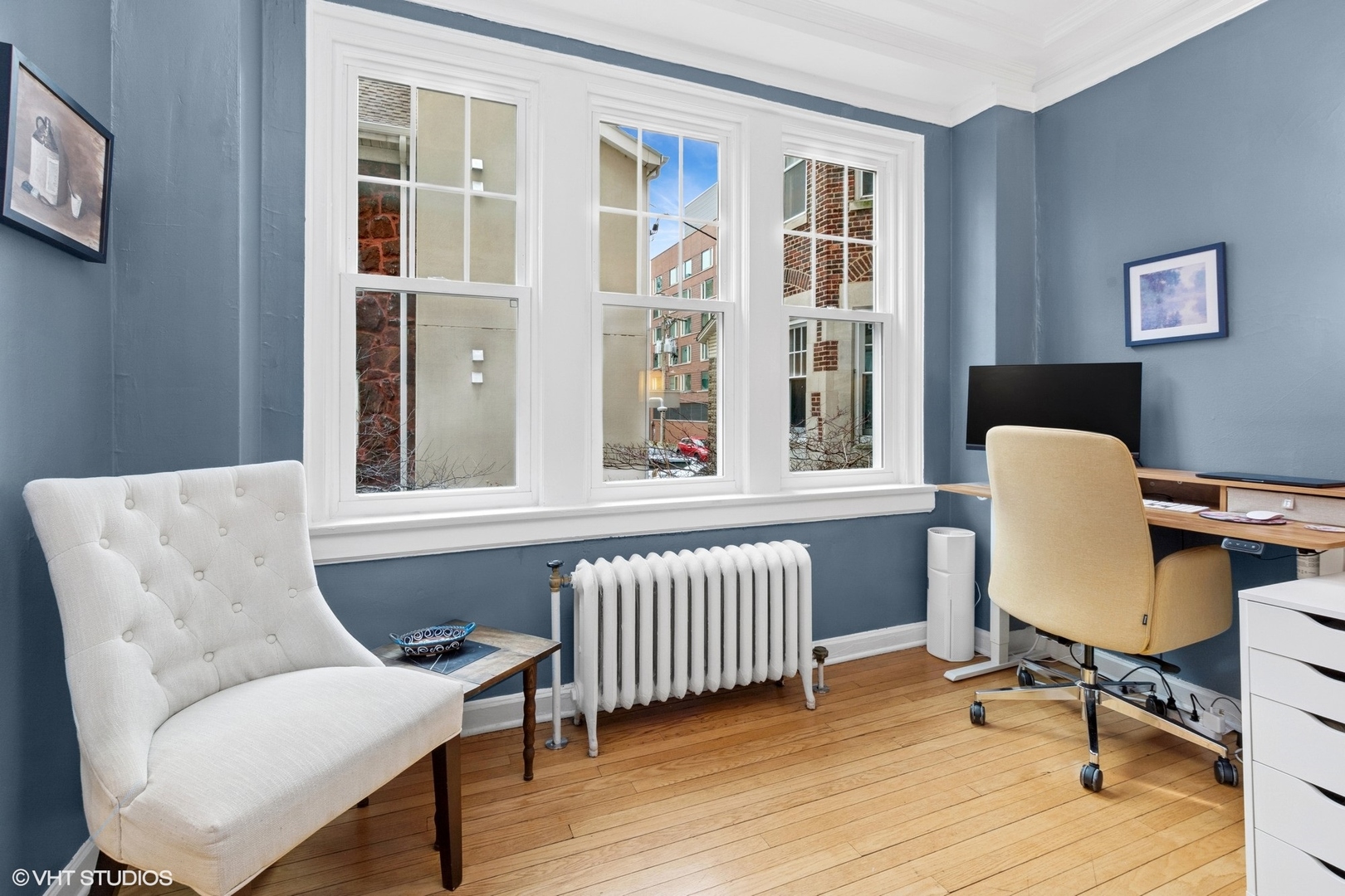 6334 North Sheridan Road, Unit 1D Chicago, IL 60660 - Photo 5 of 15 a view of a workspace with furniture and a window