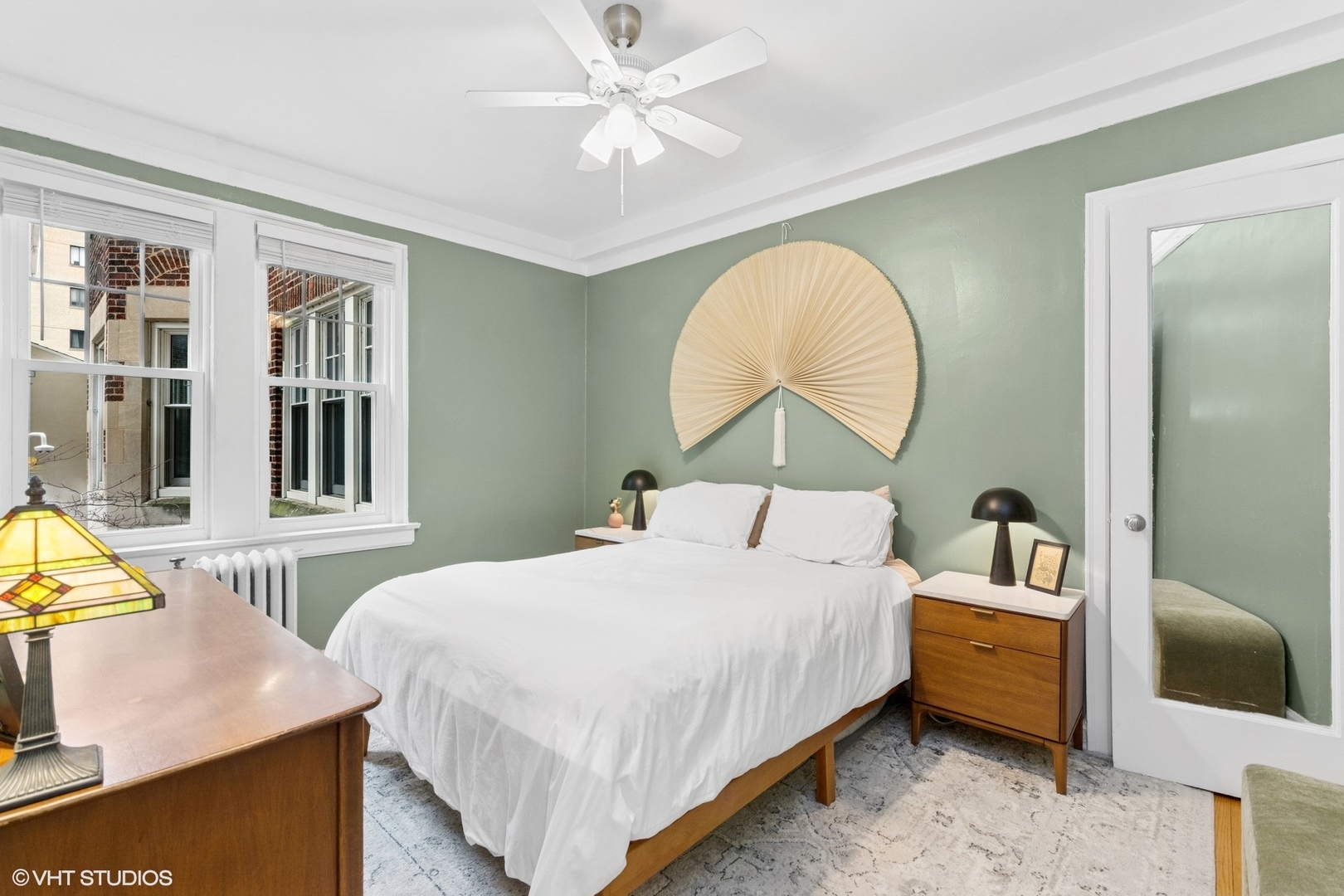 6334 North Sheridan Road, Unit 1D Chicago, IL 60660 - Photo 10 of 15 a bedroom with a bed and a chandelier
