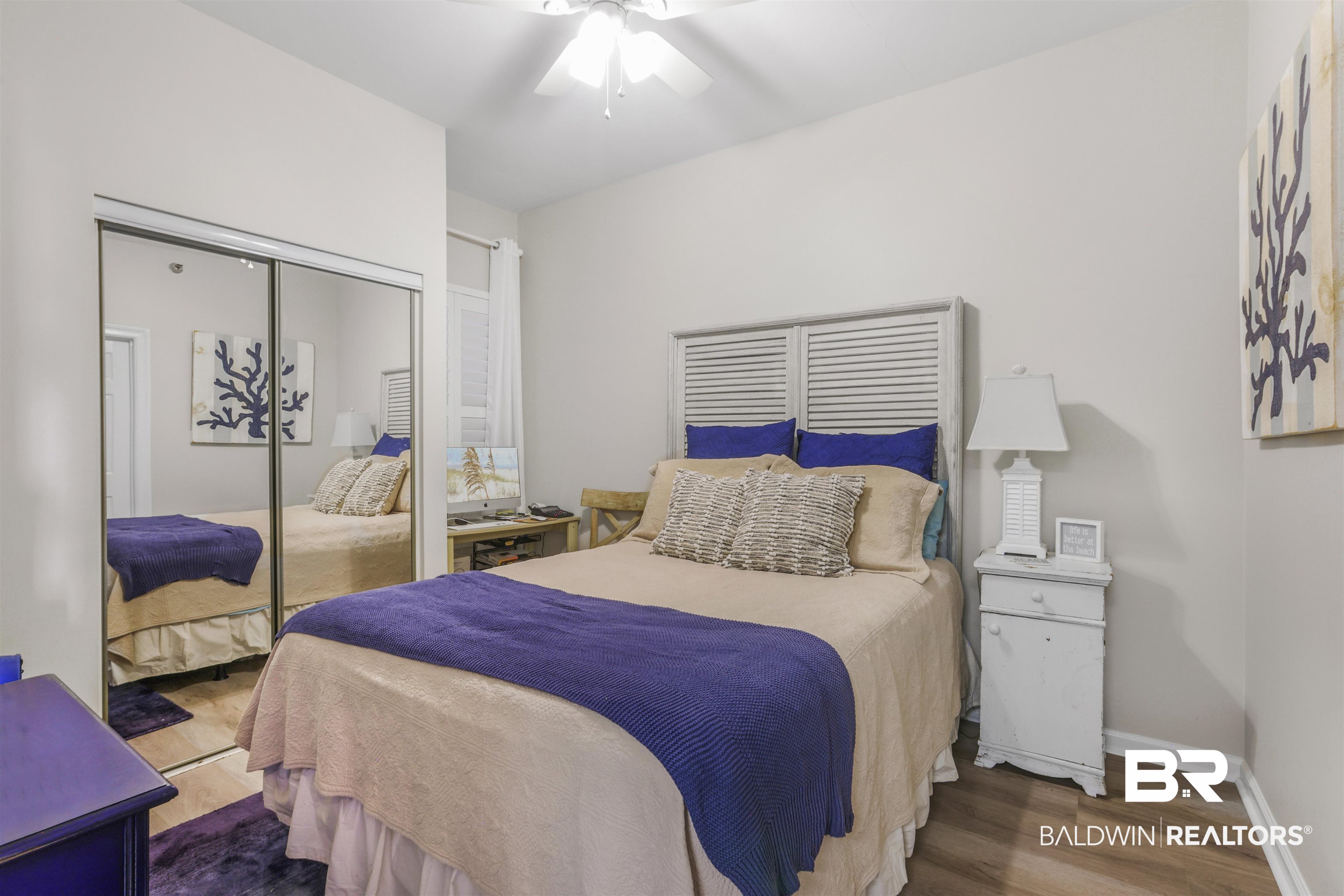 27282 Canal Road, Unit 511 Orange Beach, AL 36561 - Photo 16 of 29 Bedroom featuring ceiling fan, dark wood finished floors, and a closet