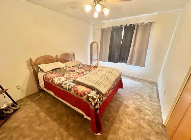 a bathroom with a tub sink and a mirror