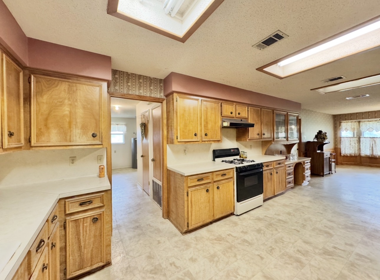 2410 State Highway 95 Elgin, TX 78621 - Photo 16 of 38 a kitchen with stainless steel appliances granite countertop a stove and a refrigerator