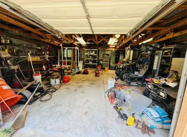 a view of a field with a trees in the background