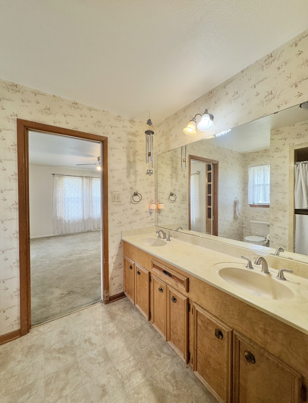 2410 State Highway 95 Elgin, TX 78621 - Photo 22 of 38 a spacious bathroom with a double vanity sink and a mirror