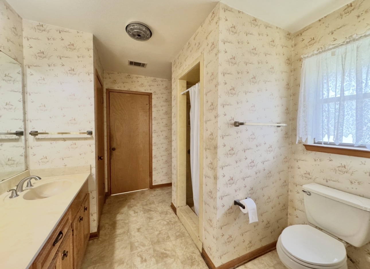 2410 State Highway 95 Elgin, TX 78621 - Photo 23 of 38 a bathroom with a granite countertop sink toilet and shower