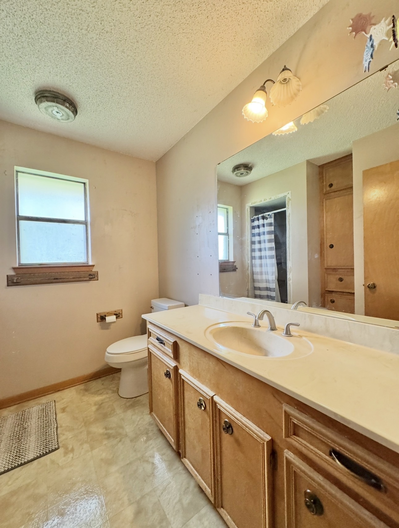 2410 State Highway 95 Elgin, TX 78621 - Photo 25 of 38 a spacious bathroom with a granite countertop sink and a mirror