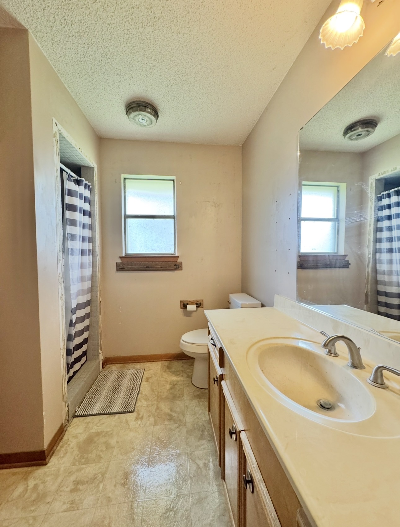 2410 State Highway 95 Elgin, TX 78621 - Photo 26 of 38 a bathroom with a sink and mirror