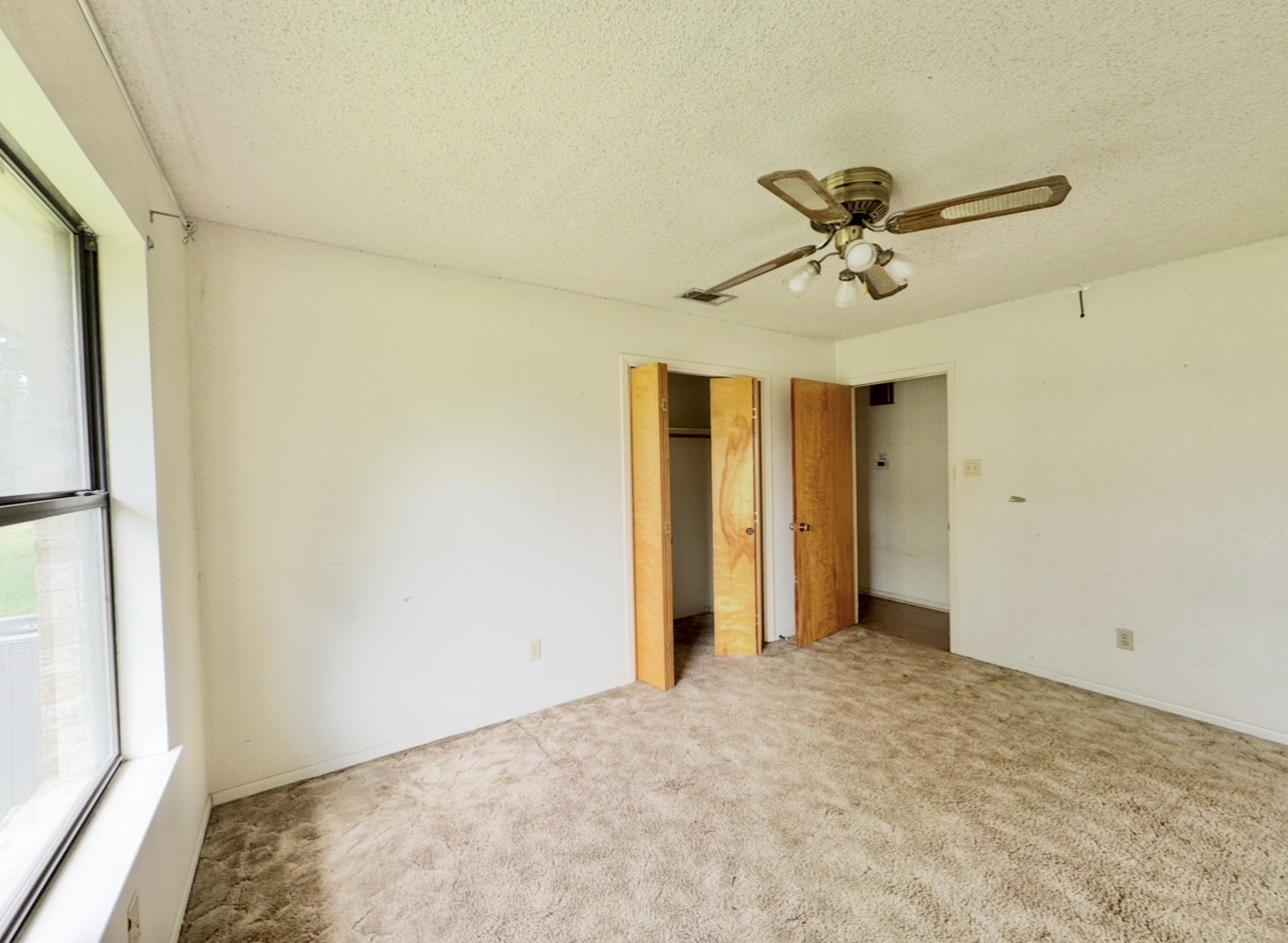 2410 State Highway 95 Elgin, TX 78621 - Photo 28 of 38 a view of a livingroom with a chandelier fan and a window