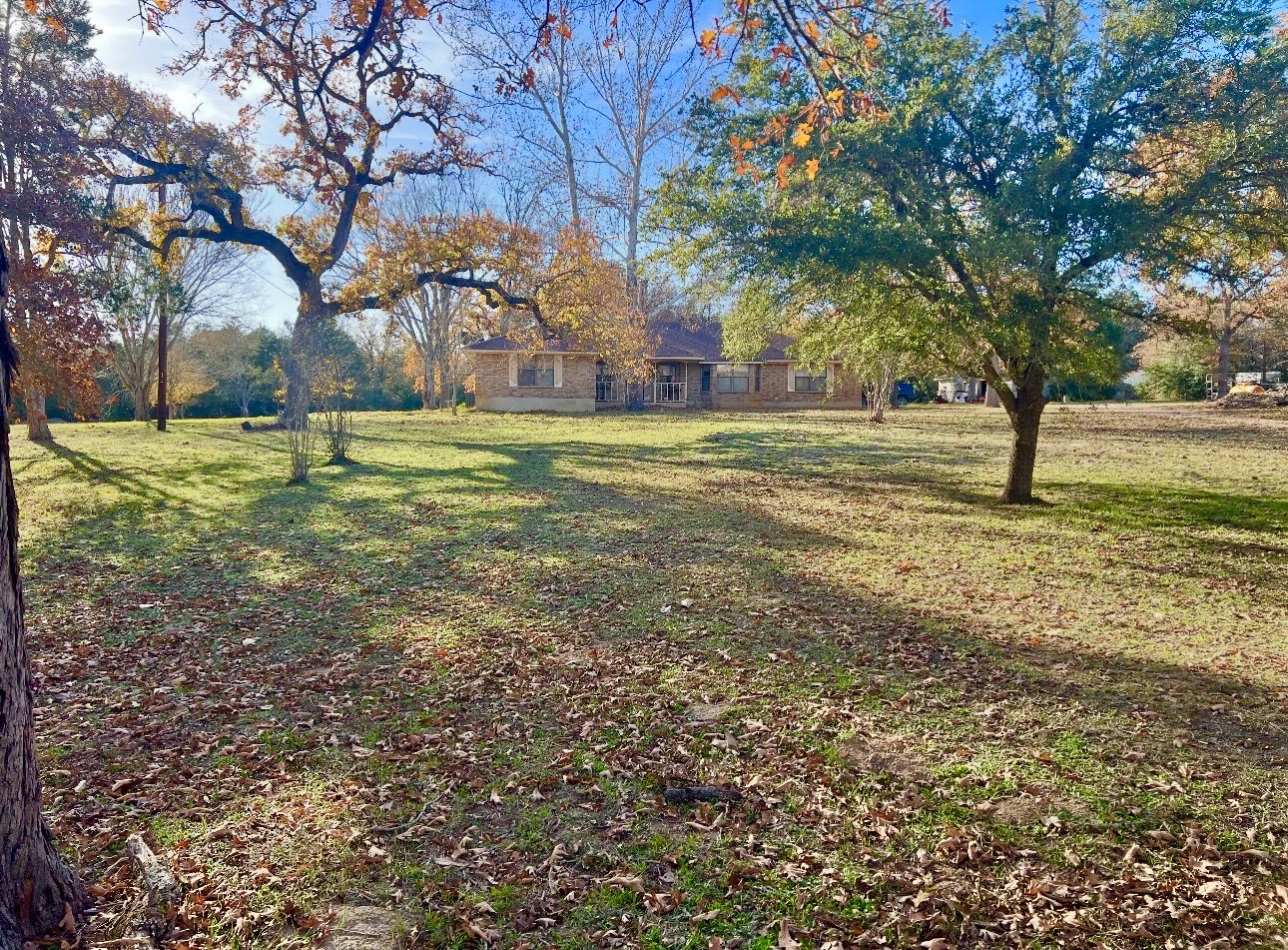 2410 State Highway 95 Elgin, TX 78621 - Photo 5 of 38 a view of a yard with trees