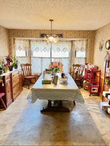 a view of a kitchen with furniture and a window