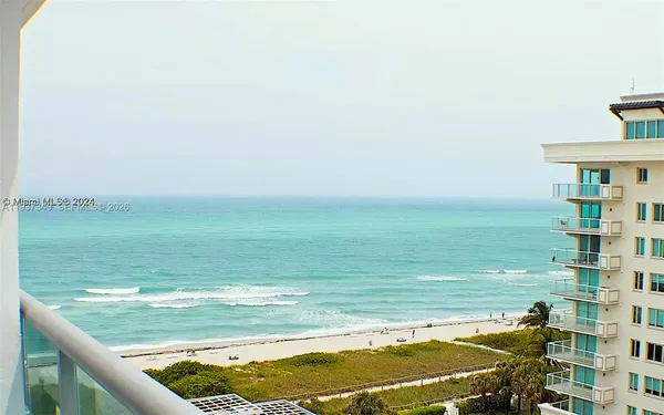 a view of a swimming pool with an ocean view