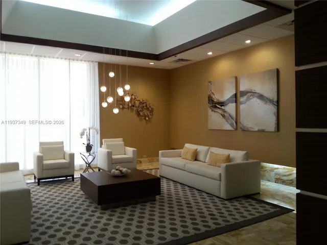 a living room with furniture window and a table