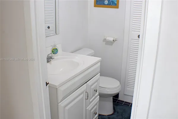 a bathroom with a sink and toilet