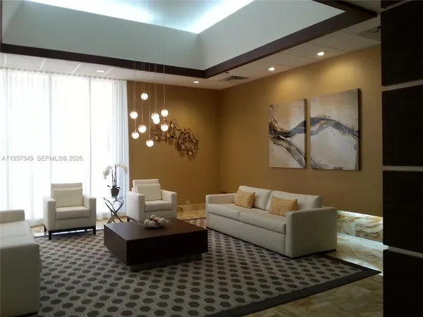 a living room with furniture window and a table