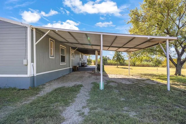 an aerial view of multiple houses with yard