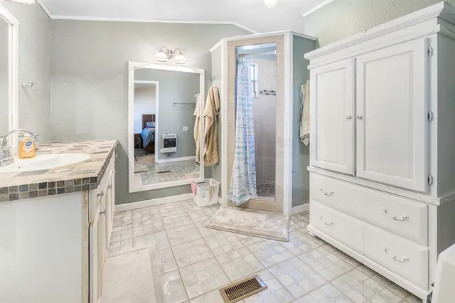 a bathroom with a sink a vanity and a mirror