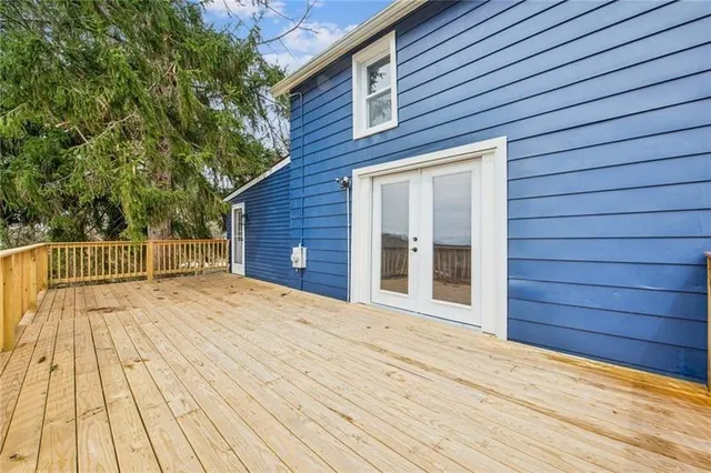 a view of backyard with a wooden deck