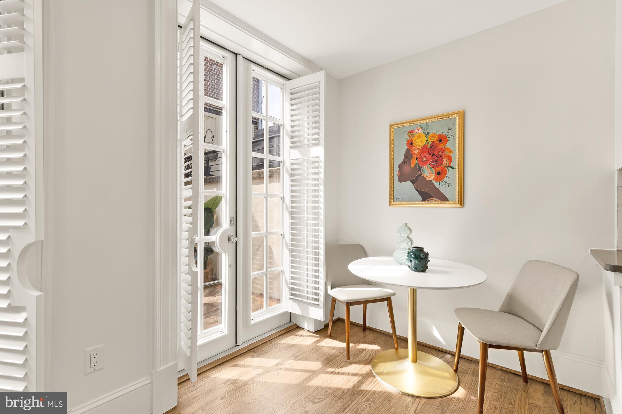 3324 18th Street Northwest, Unit 6 Washington, DC 20010 - Photo 11 of 24 a dining room with furniture and a floor to ceiling window