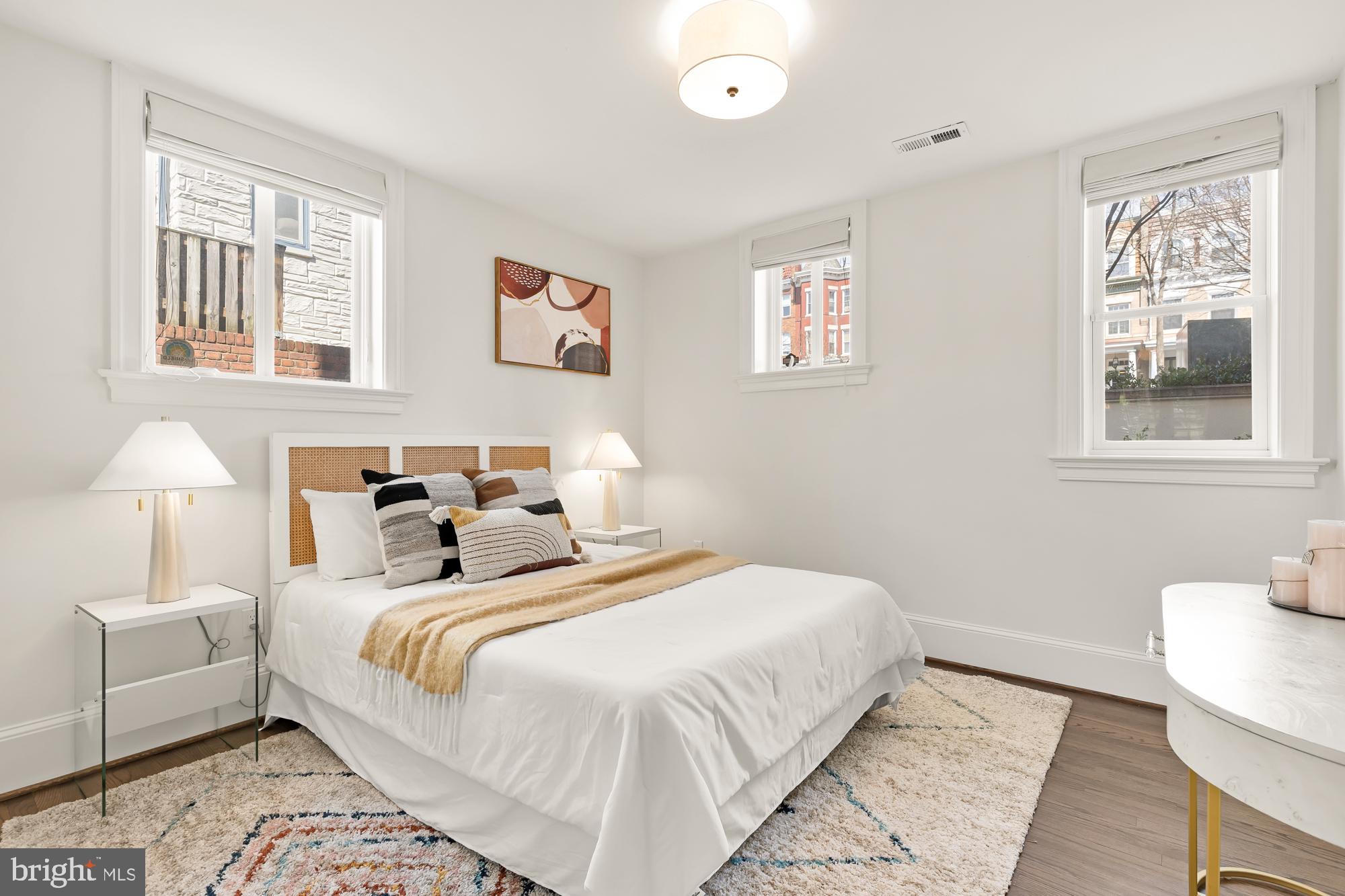 3324 18th Street Northwest, Unit 6 Washington, DC 20010 - Photo 13 of 24 a bedroom with a bed and a lamp
