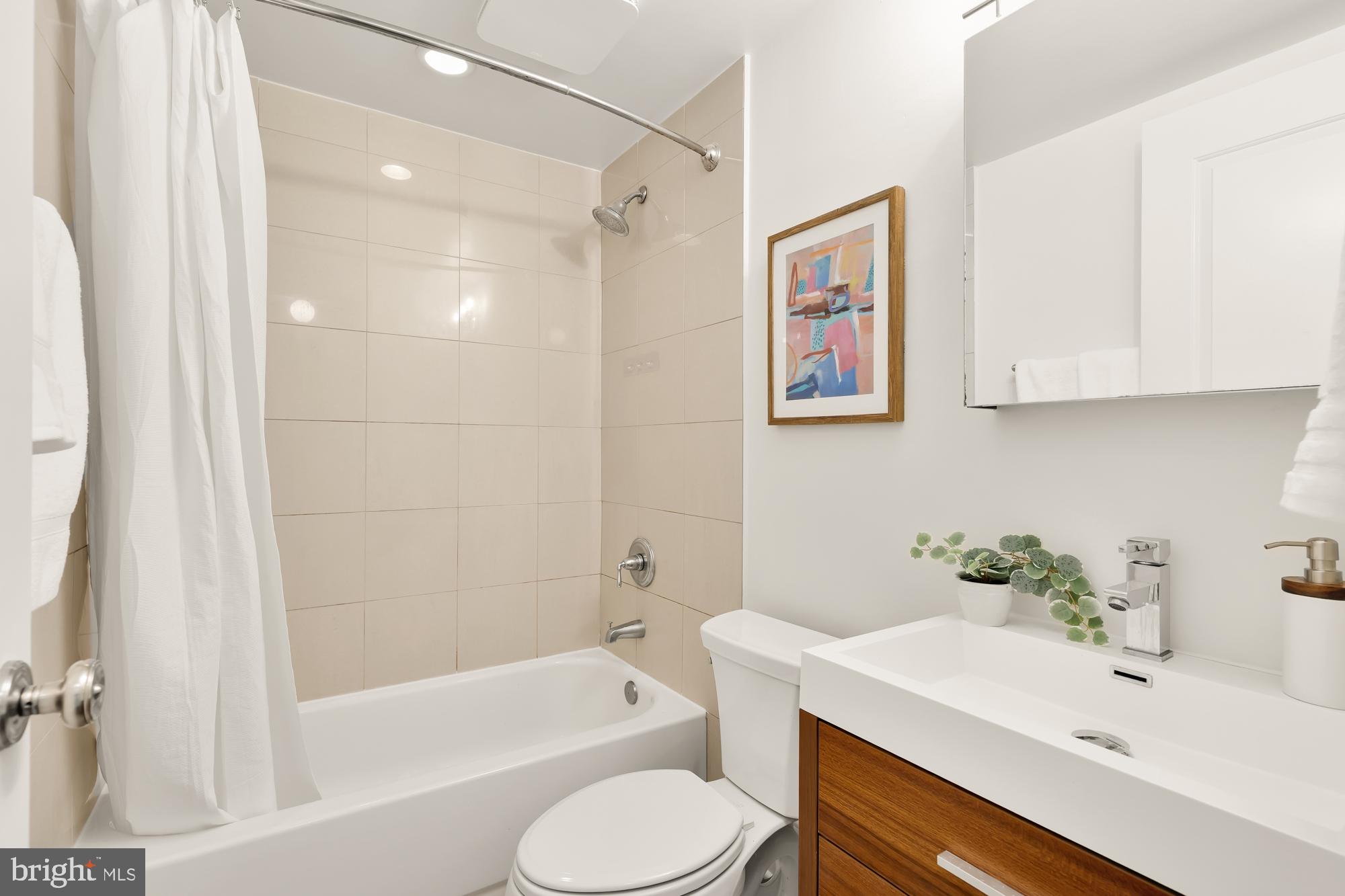3324 18th Street Northwest, Unit 6 Washington, DC 20010 - Photo 15 of 24 a bathroom with a sink toilet and bathtub