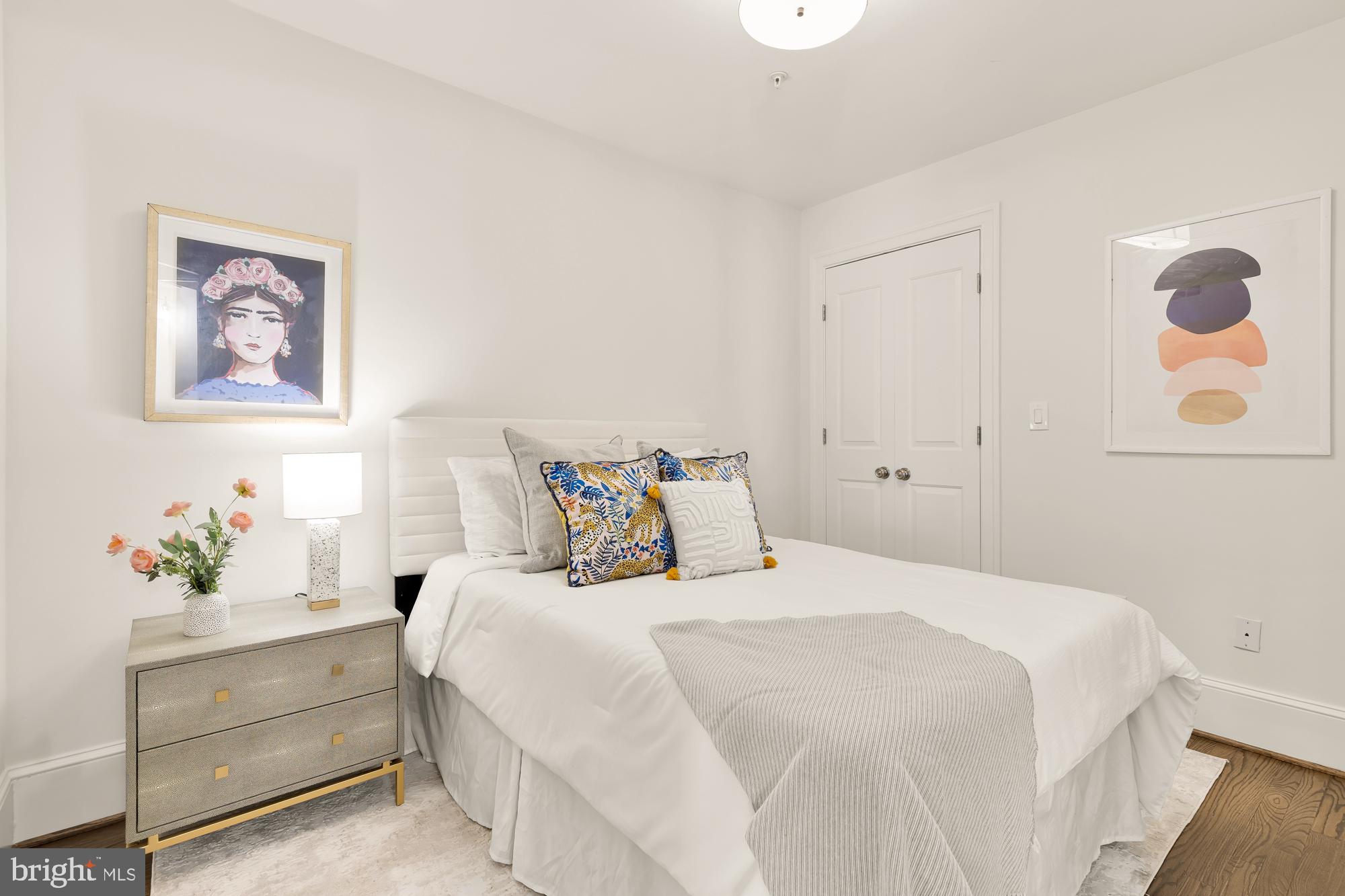 3324 18th Street Northwest, Unit 6 Washington, DC 20010 - Photo 16 of 24 a bedroom with a bed and a painting on the wall