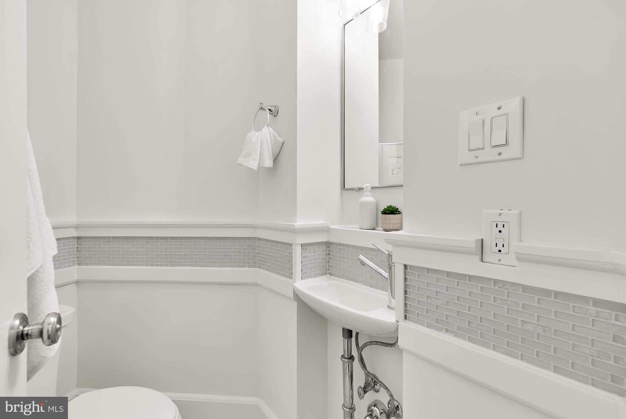 3324 18th Street Northwest, Unit 6 Washington, DC 20010 - Photo 18 of 24 a bathroom with a sink and a mirror