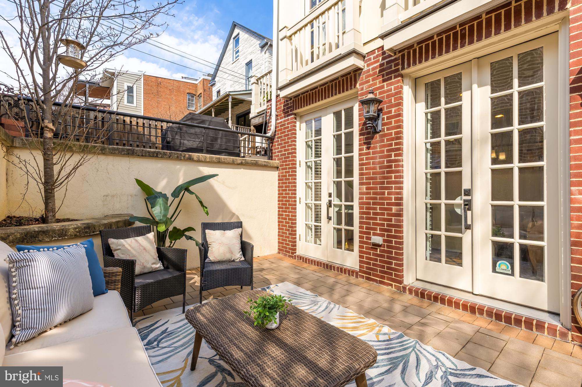 3324 18th Street Northwest, Unit 6 Washington, DC 20010 - Photo 3 of 24 a view of a patio with couches chairs and potted plants