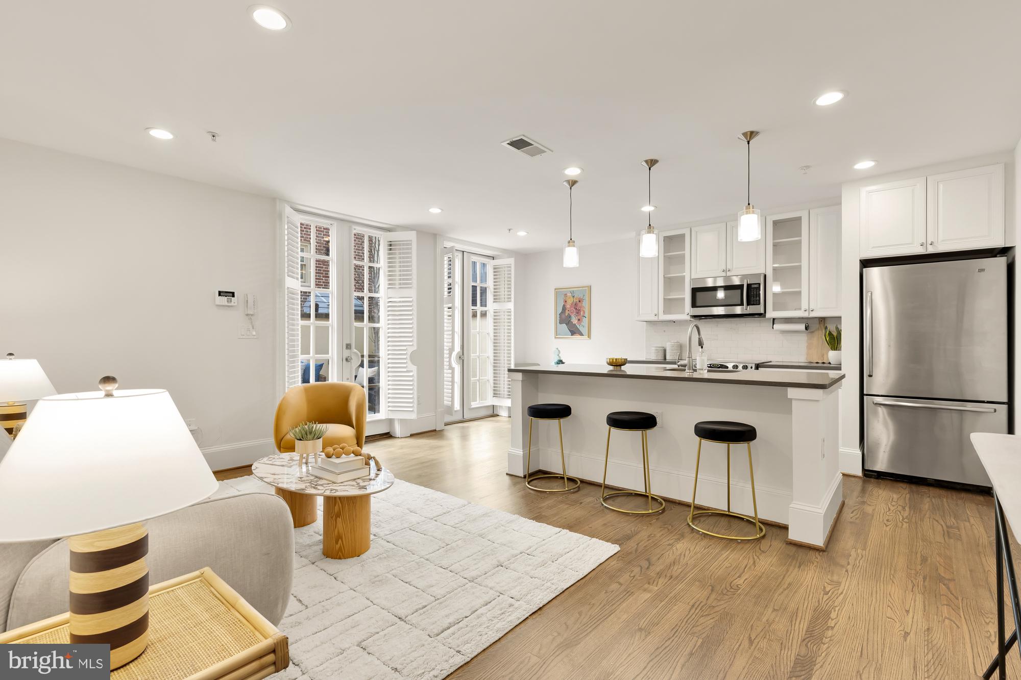 3324 18th Street Northwest, Unit 6 Washington, DC 20010 - Photo 4 of 24 a kitchen with a refrigerator and a stove top oven