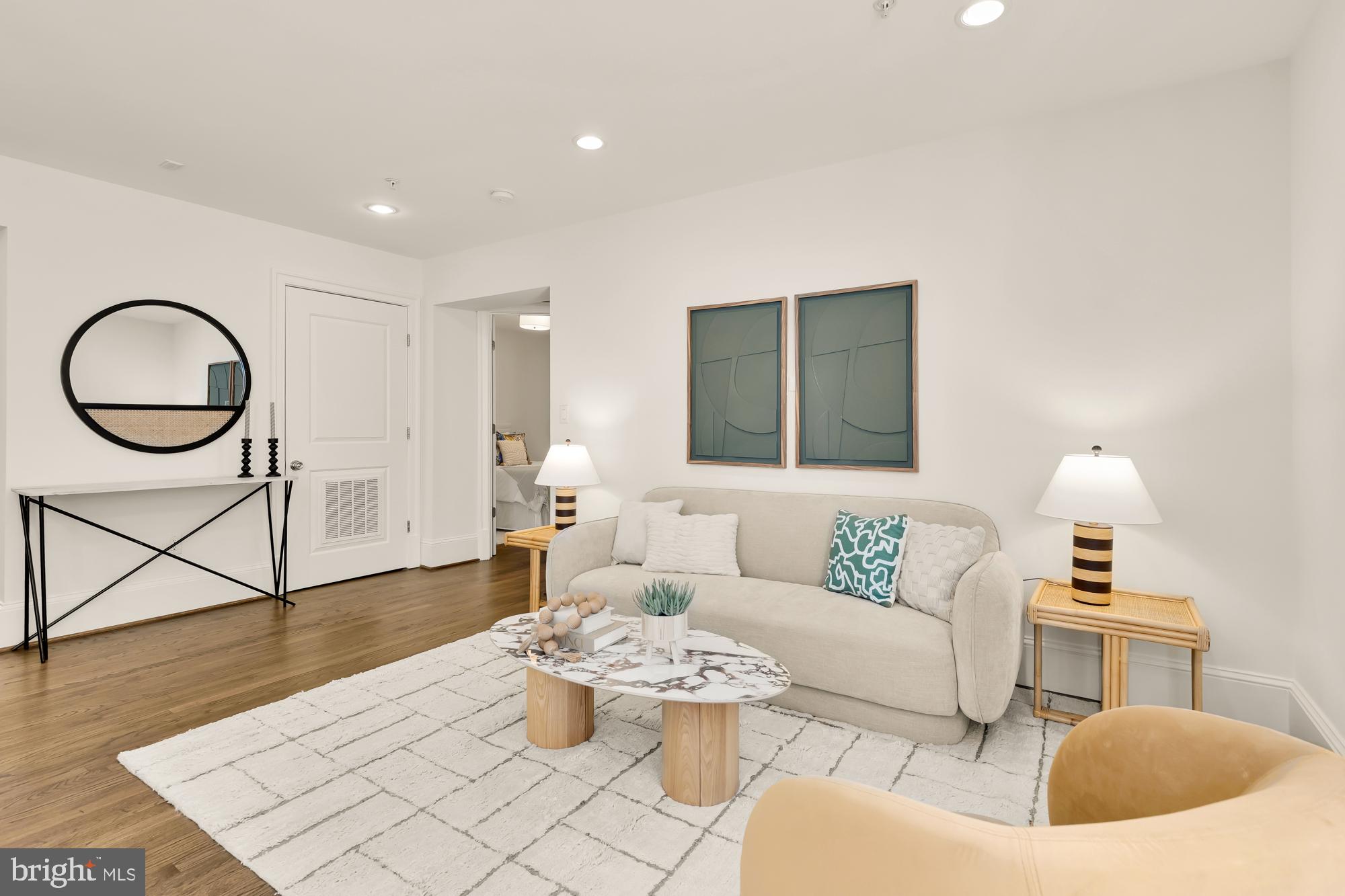 3324 18th Street Northwest, Unit 6 Washington, DC 20010 - Photo 5 of 24 a living room with furniture and wooden floor