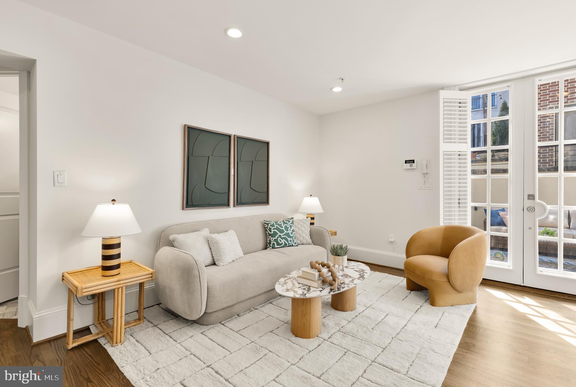 3324 18th Street Northwest, Unit 6 Washington, DC 20010 - Photo 6 of 24 a living room with furniture a rug and a window