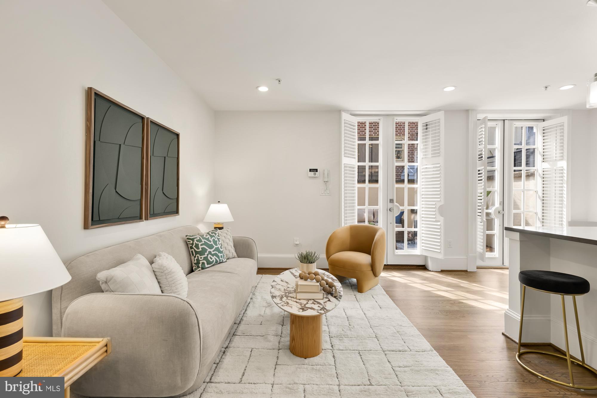 3324 18th Street Northwest, Unit 6 Washington, DC 20010 - Photo 7 of 24 a living room with furniture and a table