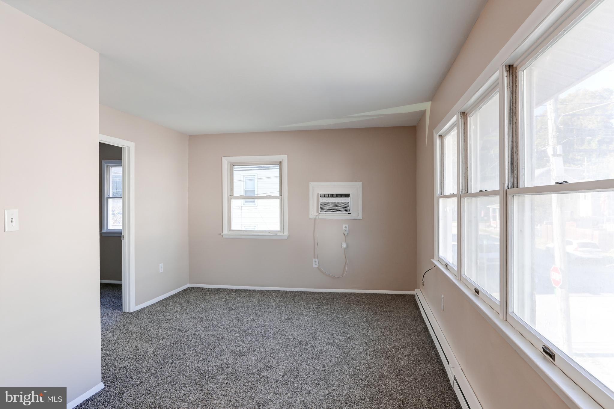 11 Poplar Street, Unit 2 Wormleysburg, PA 17043 - Photo 3 of 5 a view of an empty room with a window