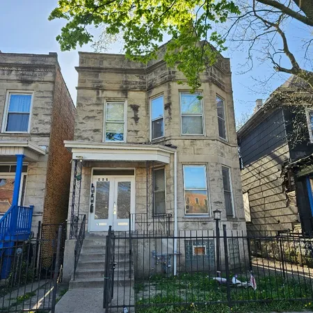 a view of a brick house with many windows