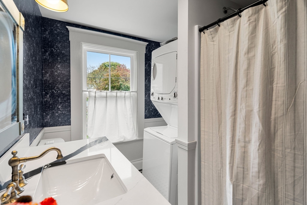 6 Mt Vernon Street, Unit 1 Marblehead, MA 01945 - Photo 11 of 14 a bathroom with a sink and a bathtub