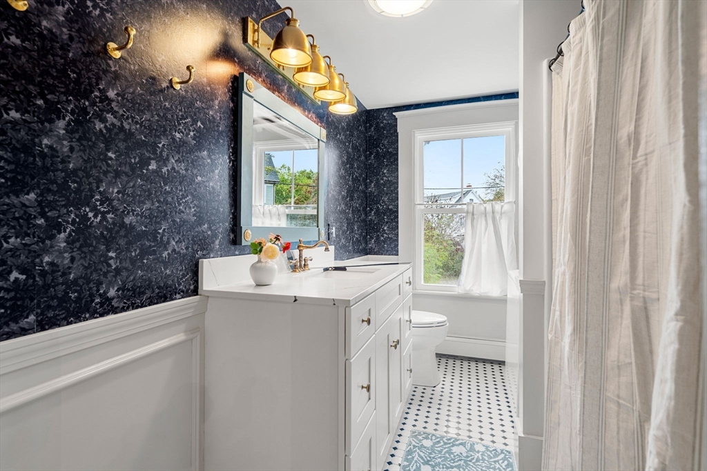 6 Mt Vernon Street, Unit 1 Marblehead, MA 01945 - Photo 10 of 14 a bathroom with a sink toilet and shower