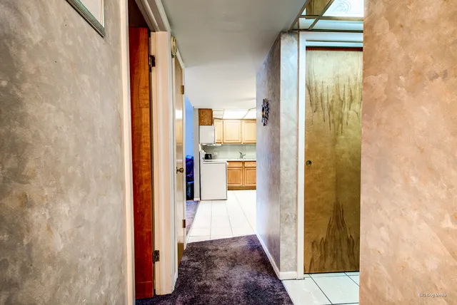 a view of a bathroom from a hallway