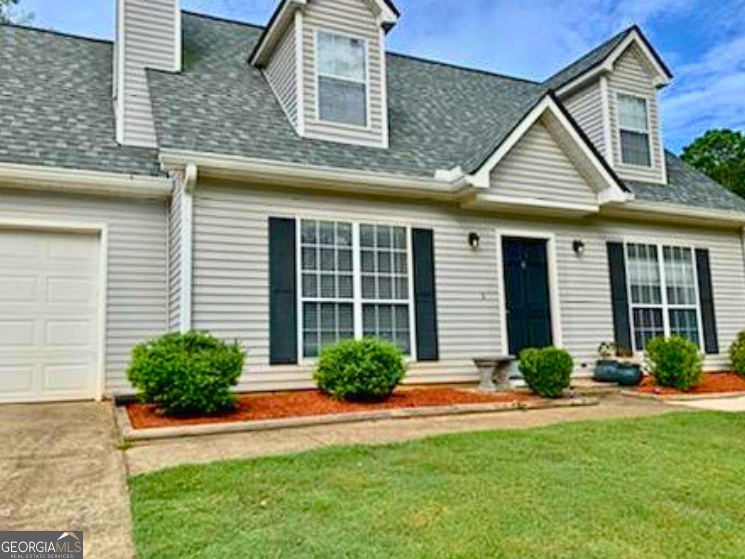 108 Sweetgum Road Peachtree City, GA 30269 - Photo 1 of 6 a front view of a house with a yard and potted plants