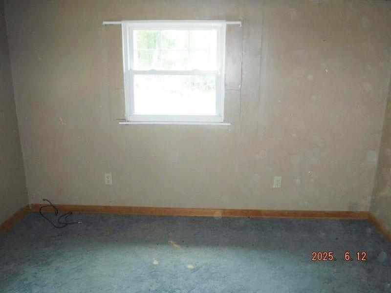822 Robin Road Saltsburg, PA 15681 - Photo 7 of 8 an empty room with a window