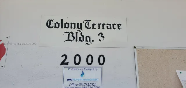 a wall with a signage