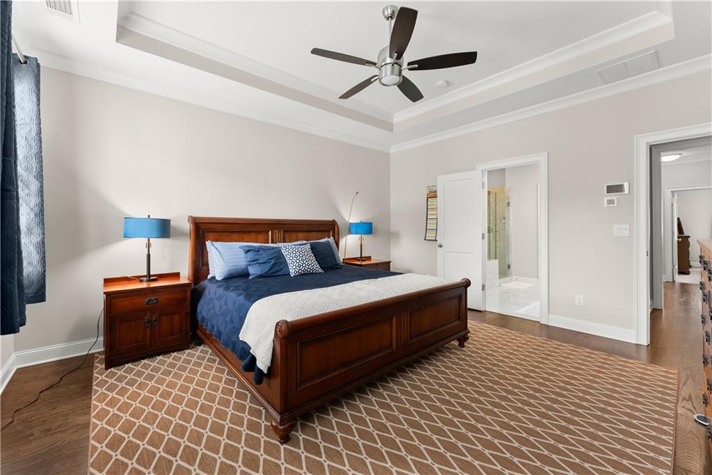 3206 Ridge Towne Place Duluth, GA 30096 - Photo 21 of 42 a bedroom with a bed ceiling fan and a rug