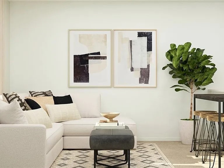 520 Commander Abbott Drive Jarrell, TX 76537 - Photo 2 of 10 a living room with furniture and a potted plant