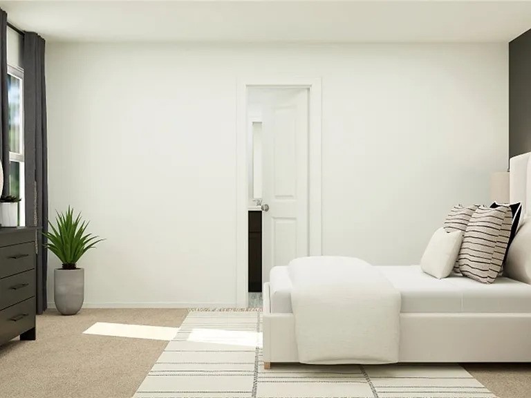 520 Commander Abbott Drive Jarrell, TX 76537 - Photo 7 of 10 a bedroom with a bed and a potted plant