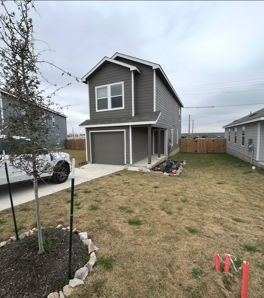 520 Commander Abbott Drive Jarrell, TX 76537 - Photo 8 of 10 a view of a house with a yard