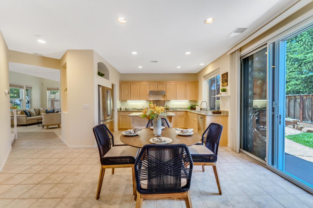 906 Schoolhouse Road San Jose, CA 95138 - Photo 12 of 57 a view of a dining room with furniture window and wooden floor