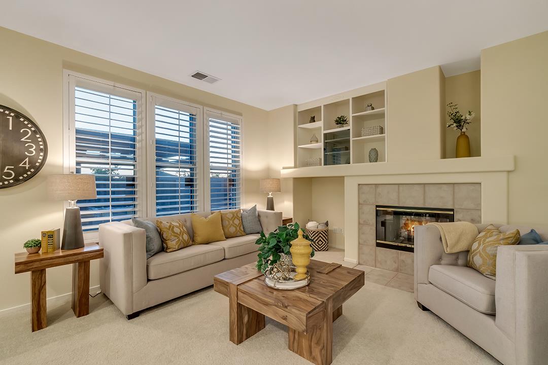 906 Schoolhouse Road San Jose, CA 95138 - Photo 18 of 57 a living room with furniture and a fireplace