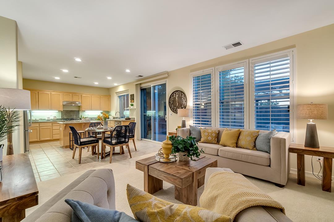 906 Schoolhouse Road San Jose, CA 95138 - Photo 19 of 57 a living room with furniture kitchen view and large windows