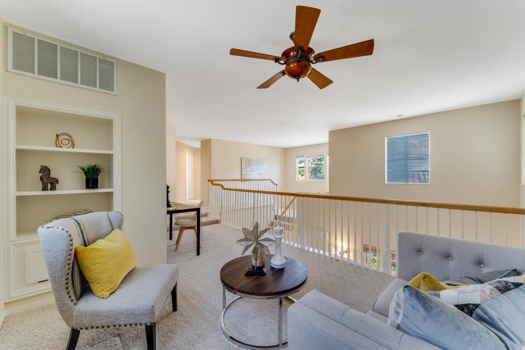 906 Schoolhouse Road San Jose, CA 95138 - Photo 23 of 57 a living room with furniture and a wooden floor